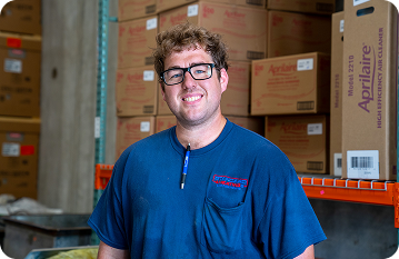 standard heating & air employee smiling into camera
