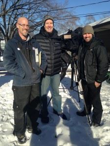 Three men smiling