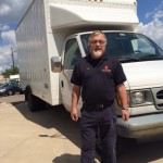 Man standing in front of a white truck