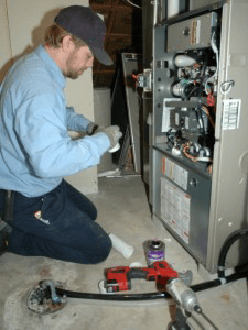 Man fixing furnace