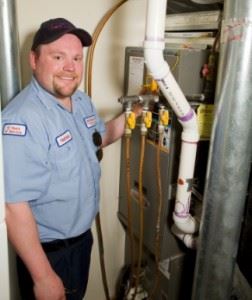 Smiling man checking on an equipment