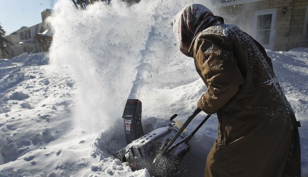 Person plowing snow