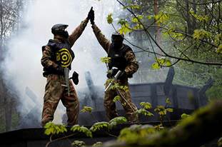 Two people in Camouflage High Five