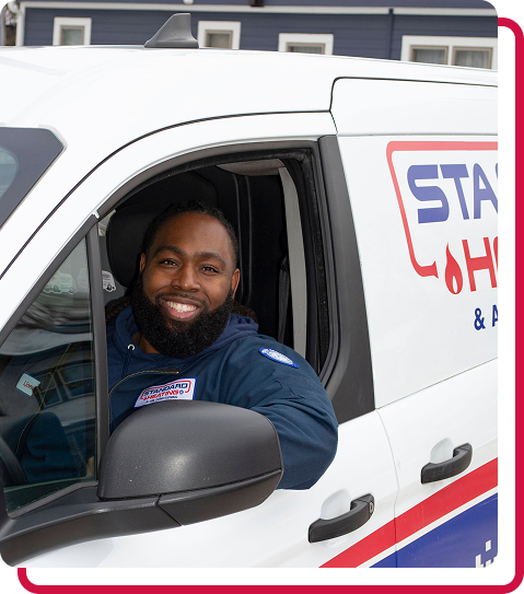 technician smiling through company van window