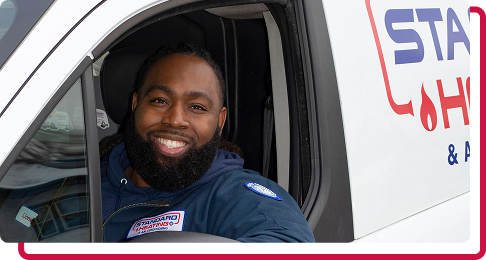 technician smiling through company van window