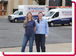 technician smiling through company van window
